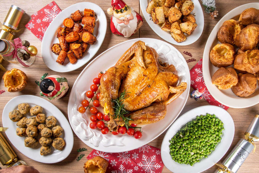 Festive Roasted Turkey 5-6KG (Served with 1000g of Roasted Potatoes, 500g of Roasted Carrots, 500g of Green Peas, 8 Yorkshire Puddings, 8 Stuffing Balls, 500ml of gravy and 250ml of Cranberry Sauce.)